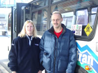 A picture of rider John Mountz and his favorite AMTRAN driver Robin in front of an AMTRAN bus